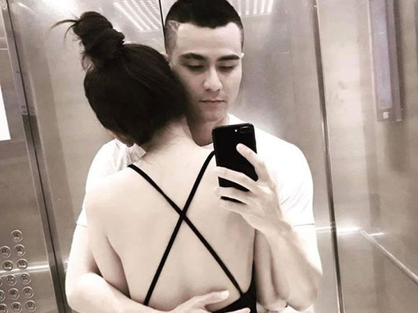 Vĩnh Thụy đăng ảnh ôm cô gái lạ giữa tin chia tay Hoàng Thùy Linh