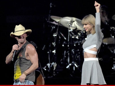 Bạn trai tình tứ ôm eo Taylor Swift khi đi xem ca nhạc