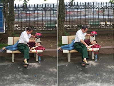 Bức ảnh người cha che nắng cho con gái giữa trưa khiến nhiều người xúc động