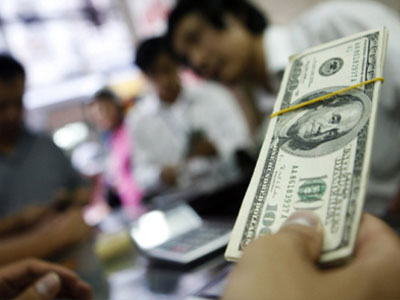 Thị trường phản ứng thế nào khi NHNN lần đầu công bố tỷ giá trung tâm?
