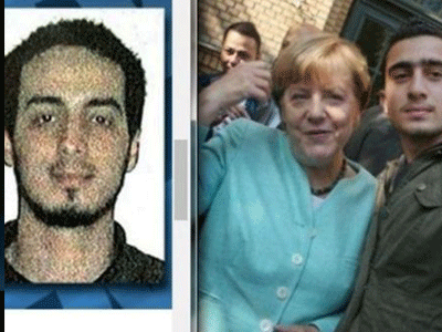 Xác định nhân vật chụp ảnh cùng bà Merkel gây tranh cãi