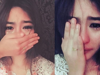 Bất ngờ với gương mặt thật của cô gái vừa che mặt vừa khóc
