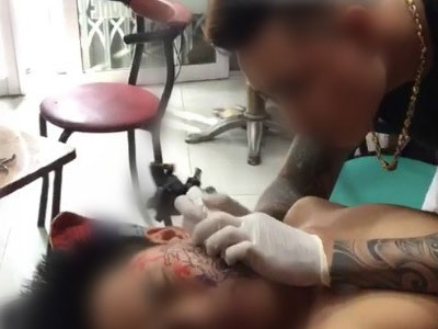 Chàng trai xăm hình kín nửa mặt vì thất tình