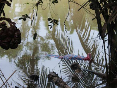 Thi thể người phụ nữ mang thai 7 tháng trôi sông