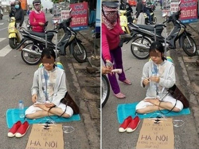 Cô gái ngồi giữa đường xin tiền về Hà Nội