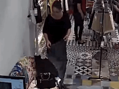 Camera ghi hình người phụ nữ trộm 22 triệu đồng ở shop thời trang
