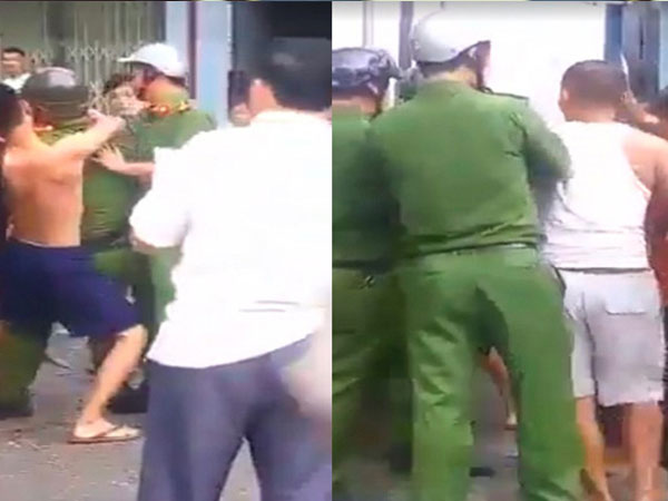 Nam thanh niên vi phạm giao thông lao vào kẹp đầu công an, đánh tới tấp