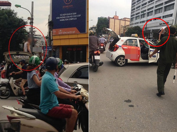 Bị nhắc nhở đi vào đường cấm, tài xế taxi trèo lên nóc xe ăn vạ