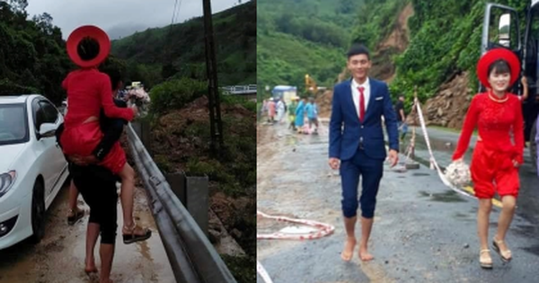 Đám cưới mùa mưa bão: Chú rể hạnh phúc cõng cô dâu vượt qua đoạn quốc lộ đầy bùn lầy để về nhà chồng